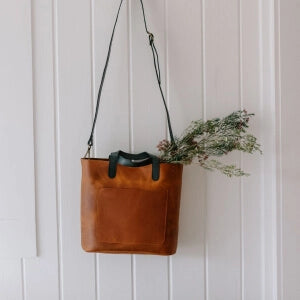 a brown bag with a plant in it