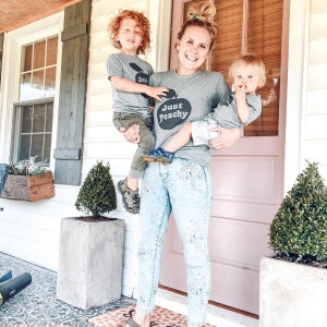 a person holding two children